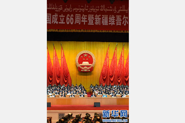 10月1日，慶祝中華人民共和國成立66周年暨新疆維吾爾自治區(qū)成立60周年大會在新疆人民會堂隆重舉行。 新華社記者 高潔 攝 